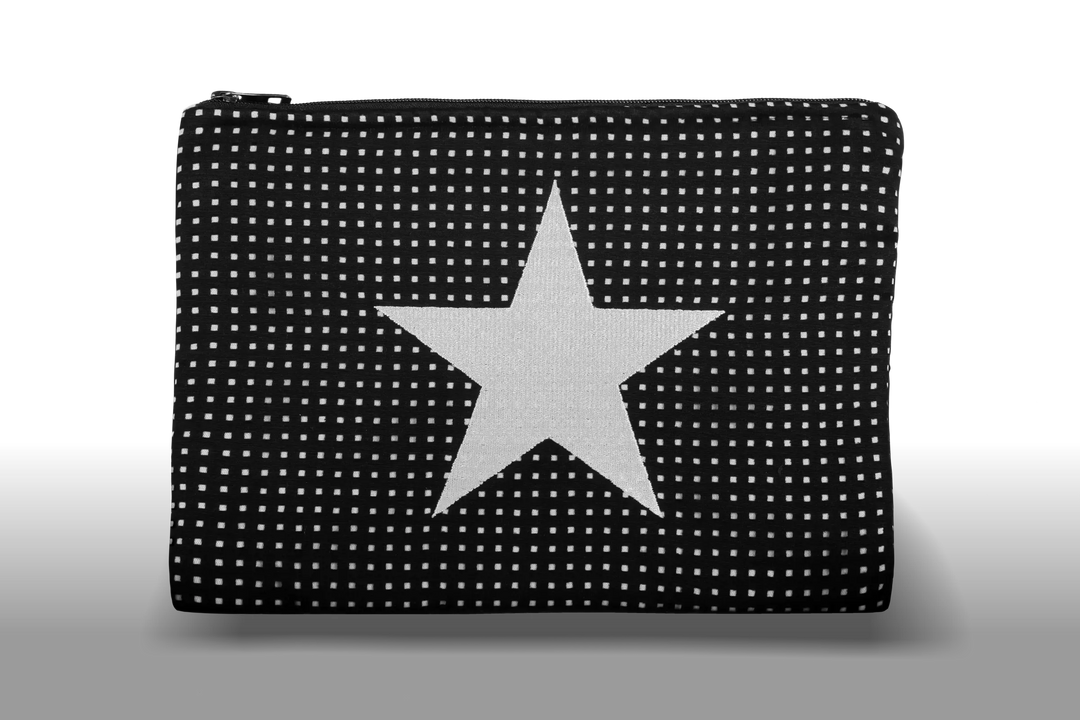 Celena Veil Star Clutch - A striking two-layer clutch featuring a bold embroidery and a pop of color beneath its black perforated surface