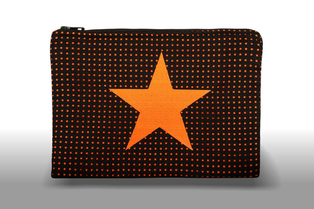 Celena Veil Star Clutch - A striking two-layer clutch featuring a bold embroidery and a pop of color beneath its black perforated surface