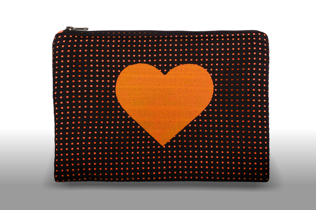 Celena Veil Heart Clutch - A striking two-layer clutch featuring a bold embroidery and a pop of color beneath its black perforated surface