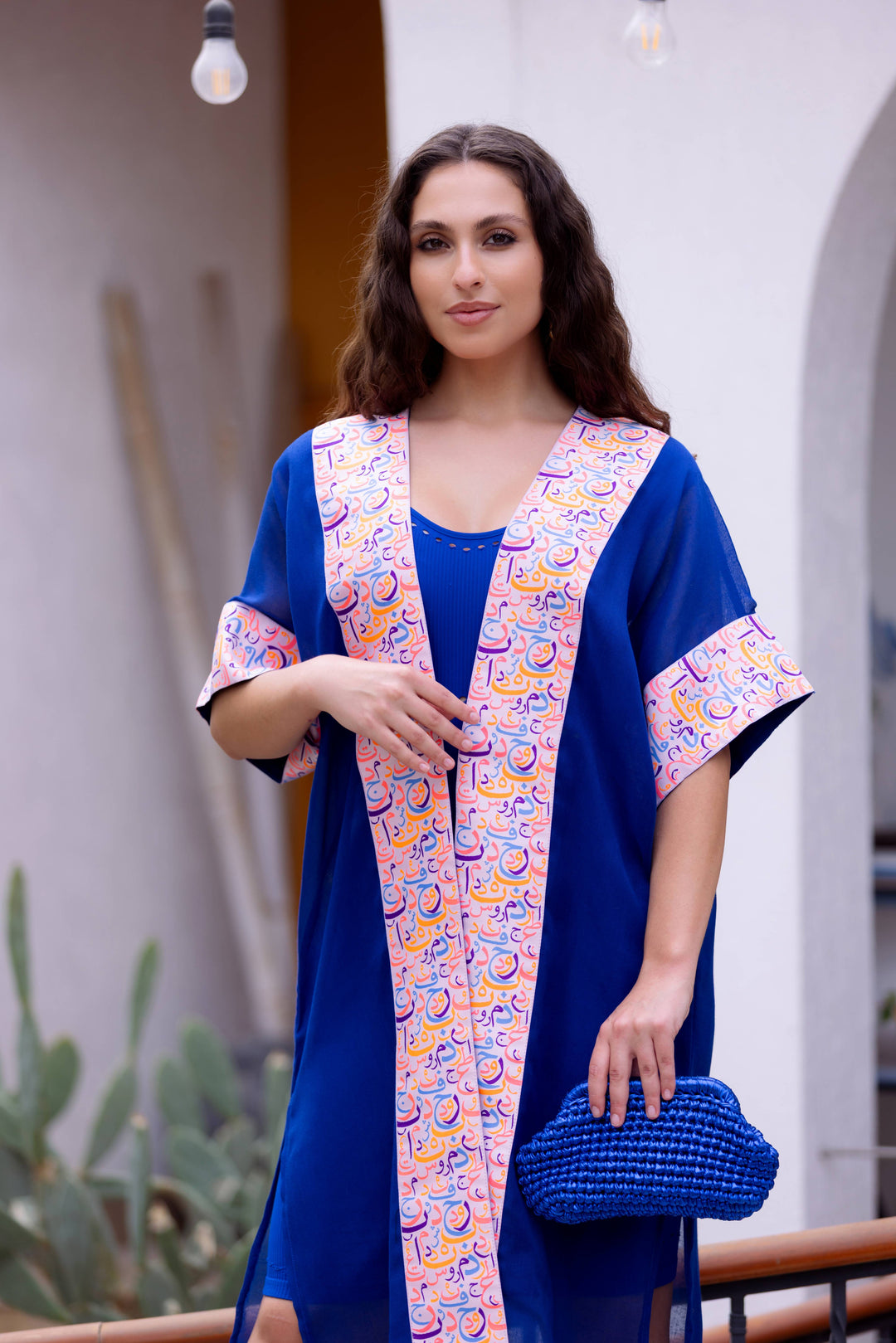 Sara's Harmony: Najaf Kaftan In Turquoise Colour with Arabic Calligraphy bordering the neckline and sleeves