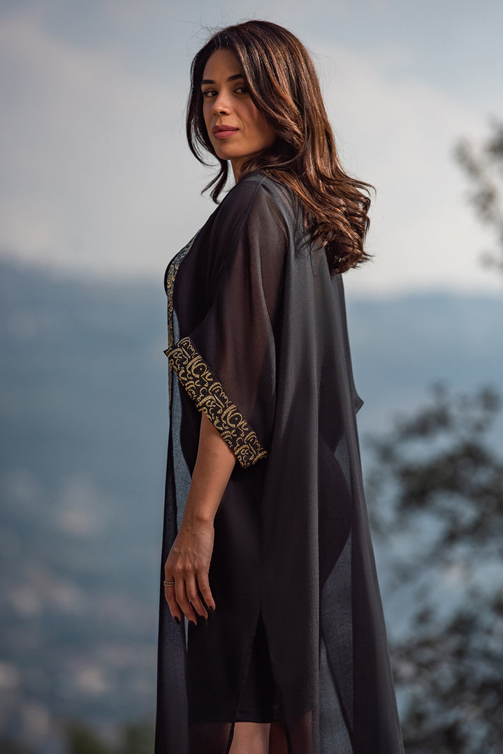 Najaf Whispers Black Kaftan
Adorned with goldish Arabic calligraphy